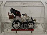 a small model of a car in a clear box