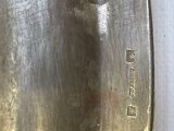 a close up of a metal spoon with a metal handle
