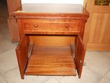 an image of a wooden cabinet with a drawer underneath it