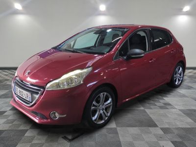 a picture of a red car parked in a garage