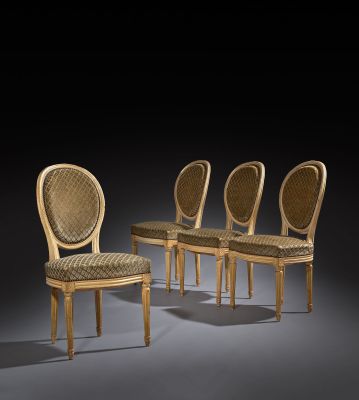 four chairs in a row on a black background