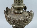 a silver lamp that is on a table