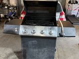 an image of a bbq grill in a garage