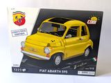 a box with a model of a small yellow car in it