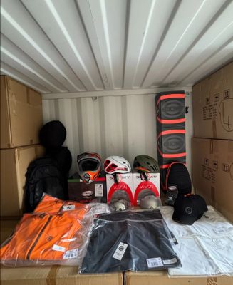 many boxes and bags in the back of a moving truck