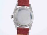 an image of a wrist watch with a red strap on a white surface