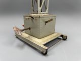 a small machine that is sitting on top of a cart
