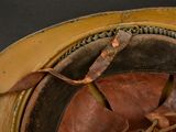a close up view of a helmet with a leather band