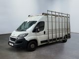 a white truck that is parked in a room