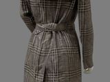 an image of a mannequin dressed in a brown and white checkered coat