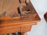 a wooden table with a piece of wood on top of it