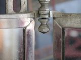 a close up of a metal door with a latch on it
