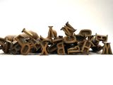 a pile of wooden letters sitting on top of each other