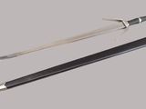 a sword and a pencil on a gray background