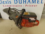an image of a chainsaw sitting on top of a table next to a sign