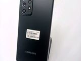 the back of a black samsung galaxy s20 with a sticker on it