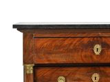 an antique chest of drawers with brass handles and a marble top