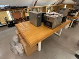 a wooden table with a bunch of appliances on it