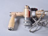 a picture of a drill with a cord attached to it
