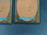 two cards that are sitting on a table