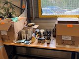a desk with a lot of boxes and bottles on it