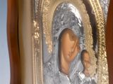 an image of a picture of a woman holding a baby in a wooden frame