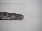 a knife that is laying on a table