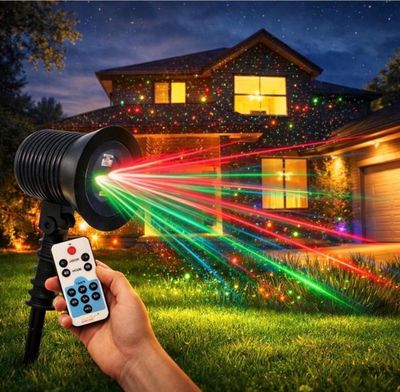 a person holding a remote control in front of a house