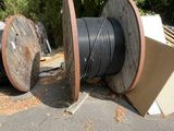 a large roll of electrical wire sitting on the ground