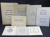 several books are stacked on top of each other on a table