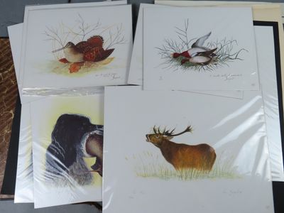 several cards with animals and birds on them sitting on a table
