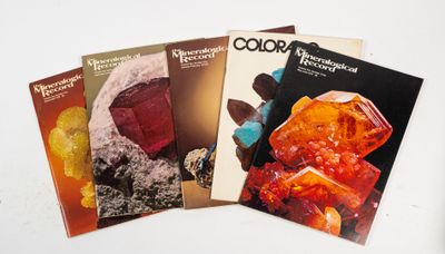 three books on a table with a white background and a white background