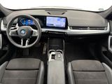 the interior of a car with a steering wheel, dashboard, and a touch screen