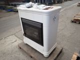 a white stove sitting on a pallet in a warehouse