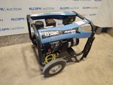 a blue portable generator sitting on top of a cement floor