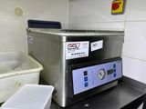 a machine that is sitting on a counter in a kitchen