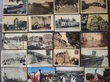 a lot of old photos of different cities on the wall