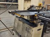 an image of a man working on a machine in a factory