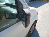 a white truck parked on the side of the road