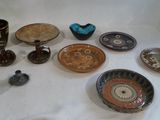 many different types of bowls and cups on the table