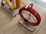 two different types of hoses sitting on a cart