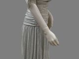 a white mannequin wearing a gray dress on a gray background