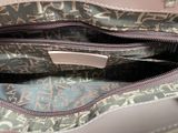 the inside of a purse with a zipper on the inside