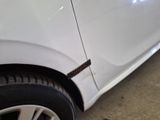 a close up of a car ' s tire with a sticker on it