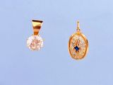 deux pendentifs en or sertis de diamants et d'une pierre bleue