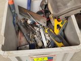 a box full of tools sitting on the floor