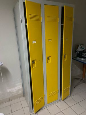 two yellow lockers next to each other in a room
