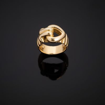 a gold ring on a black surface