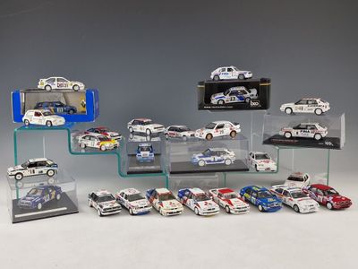 many different models of cars on display in a display case