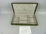 a green case that has a lot of compartments inside of it